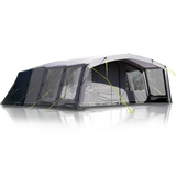 An inflatable family tent with multiple rooms, set up on a reflective surface, with a dark color and light green accents.